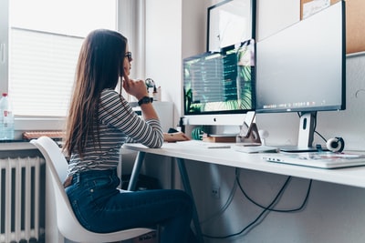 The girl in the room with desktop computers
